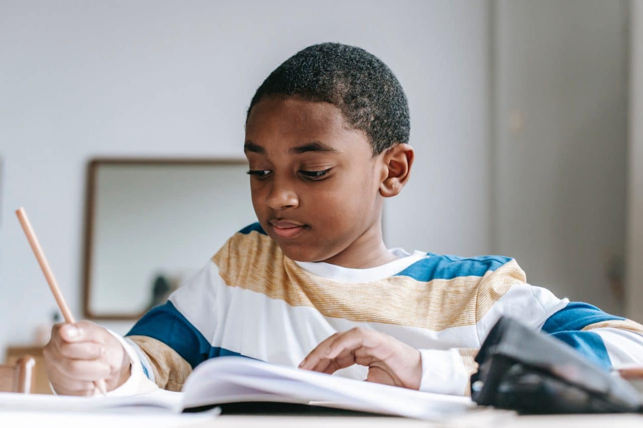 School-aged boy doing homework.