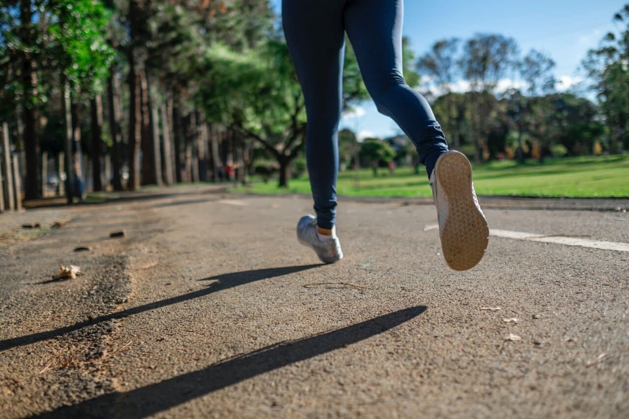 Close-up of a woman running outside.