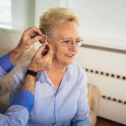 Woman getting a new hearing aid